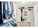 Spacious walk-in closet featuring custom shelving and racks for organizing clothes and accessories at 17319 Henslow Dr, Westfield, IN 46074