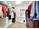 Well-appointed walk-in closet with custom shelving and hanging racks providing plenty of space for storage at 17319 Henslow Dr, Westfield, IN 46074