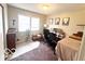 Cozy bedroom features a desk, bright windows, and neutral decor, creating a functional and inviting space at 1820 Martin St, Indianapolis, IN 46237