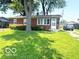 Brick ranch home with a green lawn, offering a comfortable suburban lifestyle at 1820 Martin St, Indianapolis, IN 46237