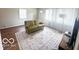 Bright living room featuring hard wood flooring, a couch and large windows at 1820 Martin St, Indianapolis, IN 46237