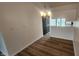 Dining area featuring modern lighting, fresh paint, and elegant flooring, creating an inviting ambiance at 1836 Queensbridge Cir, Indianapolis, IN 46219