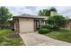 Cozy single Gathering home featuring an attached garage and well maintained front lawn at 1836 Queensbridge Cir, Indianapolis, IN 46219