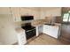 Updated kitchen with stainless appliances, stylish countertops, and bright white cabinets at 1836 Queensbridge Cir, Indianapolis, IN 46219