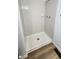 This basic tiled shower features a shower head, soap dish, and drain at 1836 Queensbridge Cir, Indianapolis, IN 46219