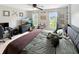 Bedroom featuring a queen bed, desk, TV, and windows allowing natural light at 2015 Deer Lake Dr, Martinsville, IN 46151