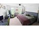 Spacious bedroom with a workspace, beanbag chair, large bed, and unique decor at 2015 Deer Lake Dr, Martinsville, IN 46151
