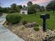 Charming two-story brick home with a landscaped yard and a black mailbox at 2015 Deer Lake Dr, Martinsville, IN 46151