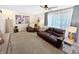 Comfortable living room with plush seating, a ceiling fan, and natural light at 2015 Deer Lake Dr, Martinsville, IN 46151
