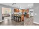 Open kitchen featuring bar seating, stainless steel appliances, and seamless connection to the living area at 2115 Napa Cir, Indianapolis, IN 46214