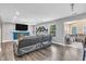 Bright living room features hardwood floors, fireplace, tv, and plenty of natural light at 2115 Napa Cir, Indianapolis, IN 46214
