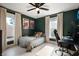 Bright bedroom with green walls, wood floors, and two windows offering natural light at 22 N Bolton Ave, Indianapolis, IN 46219