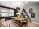 Stylish dining room with a rustic wooden table, modern lighting, and unique decor at 22 N Bolton Ave, Indianapolis, IN 46219