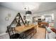 Cozy dining area with a rustic table, open to the kitchen, and comfortable seating at 22 N Bolton Ave, Indianapolis, IN 46219