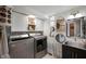Laundry room with a washer and dryer, decor items, and ample storage at 22 N Bolton Ave, Indianapolis, IN 46219