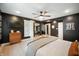 Large main bedroom with dark walls, natural light, wood floors, and connected office space at 22 N Bolton Ave, Indianapolis, IN 46219