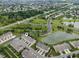 Overhead view of townhomes surrounded by green spaces, water features, and roads at 258 Coatsville Dr, Westfield, IN 46074