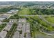 Expansive aerial view showcasing a community with townhomes, green spaces, and nearby amenities at 258 Coatsville Dr, Westfield, IN 46074