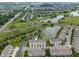Aerial view showcasing townhomes in a neighborhood with water features, green spaces, and convenient access at 258 Coatsville Dr, Westfield, IN 46074
