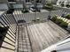 Wooden outdoor balcony with black railings overlooking neighborhood at 258 Coatsville Dr, Westfield, IN 46074
