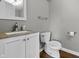 Clean bathroom featuring a vanity, toilet, and chrome fixtures, offering a comfortable and functional space at 258 Coatsville Dr, Westfield, IN 46074
