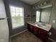 Bright bathroom showcasing a double sink vanity and a window for natural lighting at 258 Coatsville Dr, Westfield, IN 46074