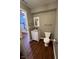 The half bathroom features a modern vanity, mirror, and wood flooring at 258 Coatsville Dr, Westfield, IN 46074