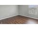 Small bedroom featuring hardwood floors, a window allowing for natural light, and light-colored walls at 258 Coatsville Dr, Westfield, IN 46074