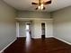 Bedroom featuring hardwood floors, neutral colored walls, and passageways to a closet and other rooms at 258 Coatsville Dr, Westfield, IN 46074