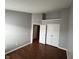Open bedroom displaying a hardwood floor and closet and entry door at 258 Coatsville Dr, Westfield, IN 46074