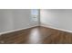 Cozy bedroom featuring hardwood floors and a window allowing for natural light at 258 Coatsville Dr, Westfield, IN 46074