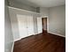 The bedroom features hardwood floors, white trim and bi-fold doors to the closet and entry to the room at 258 Coatsville Dr, Westfield, IN 46074