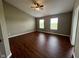 Bedroom features natural light, complemented by wood flooring and neutral walls at 258 Coatsville Dr, Westfield, IN 46074