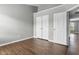 Bedroom with hardwood floors, a closet, and a doorway leading into a bathroom at 258 Coatsville Dr, Westfield, IN 46074