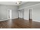 Large bedroom with hardwood floors, ensuite bathroom, a walk-in closet, and classic ceiling fan at 258 Coatsville Dr, Westfield, IN 46074