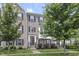 Brick townhome with beautifully landscaped front yard, providing a welcoming entrance at 258 Coatsville Dr, Westfield, IN 46074