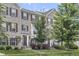 Attractive brick townhome with well-maintained lawn and landscaping, offering curb appeal at 258 Coatsville Dr, Westfield, IN 46074