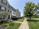 Attractive brick townhouses with sidewalks, landscaped yards, and mature trees in a well-maintained community at 258 Coatsville Dr, Westfield, IN 46074