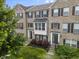 Charming brick townhome with well-maintained landscaping and traditional architectural details at 258 Coatsville Dr, Westfield, IN 46074