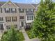 Attractive brick townhome with well-maintained landscaping and a welcoming front entrance at 258 Coatsville Dr, Westfield, IN 46074