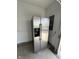 Garage with stainless steel refrigerator with ice and water dispenser at 258 Coatsville Dr, Westfield, IN 46074