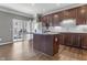 Open kitchen featuring a central island, stainless steel appliances and sliding glass doors at 258 Coatsville Dr, Westfield, IN 46074