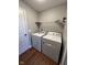 Functional laundry room with washer, dryer, shelving, and convenient access at 258 Coatsville Dr, Westfield, IN 46074