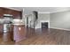 Open-concept layout with modern kitchen island flowing into the cozy fireplace-lit living area at 258 Coatsville Dr, Westfield, IN 46074