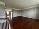 Spacious living room featuring hardwood floors, crown molding, and natural light at 258 Coatsville Dr, Westfield, IN 46074