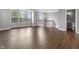 Living area with hardwood floors, staircase, and bright natural light from large windows at 258 Coatsville Dr, Westfield, IN 46074