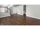 Open living space with hardwood floors, staircase, and access to a bathroom at 258 Coatsville Dr, Westfield, IN 46074