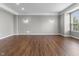 Open living area with hardwood floors, recessed lighting, and large bay windows at 258 Coatsville Dr, Westfield, IN 46074
