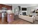 Open concept living room featuring a fireplace, adjacent to the kitchen with an island and modern appliances at 258 Coatsville Dr, Westfield, IN 46074