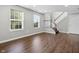 Open living space with hardwood floors, staircase, and natural light at 258 Coatsville Dr, Westfield, IN 46074